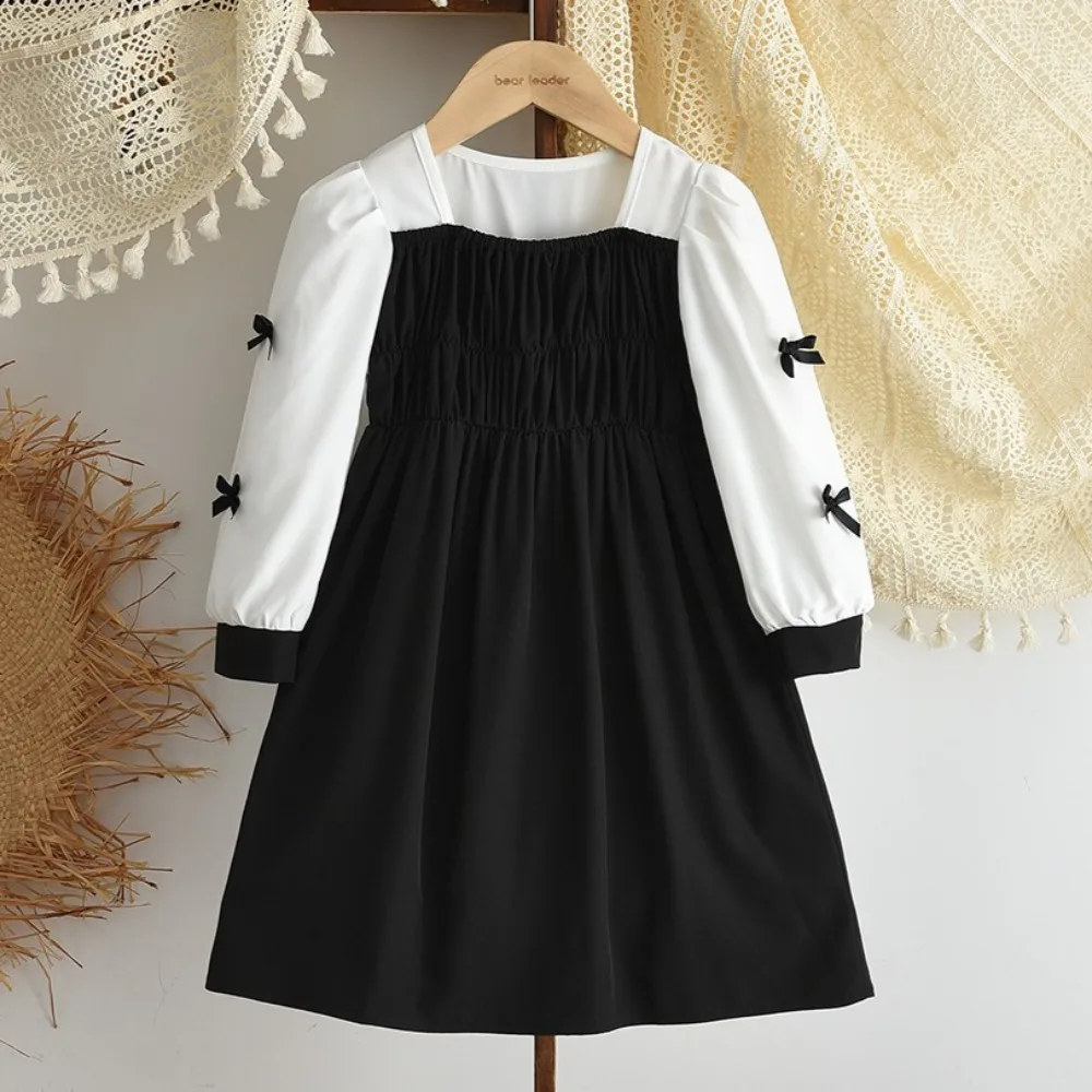 ชุดเดรสลำลองเด็กผู้หญิง สไตล์มินิมอล สีดำขาว สำหรับเด็กอายุ 3-7 ปี รุ่นใหม่ประจำฤดูใบไม้ร่วง ดีไซน์ตัดสี แต่งโบว์ แฟชั่นทันสมัย