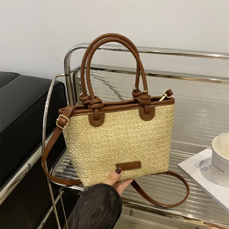 Pastoral hand-held straw bucket bag women's light luxury niche high-end messenger woven bag