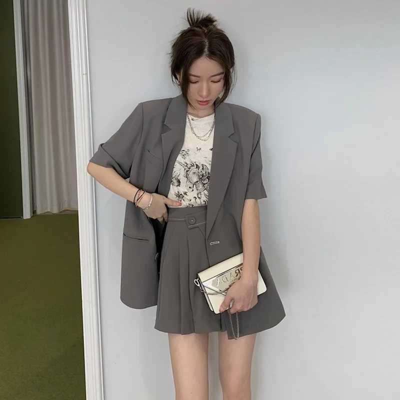 

Summer 2025 Korean Sle Casual Loose ort Sve Suit Jaet High Waist Pleated Skirt Two Piece Set Profional Outfit