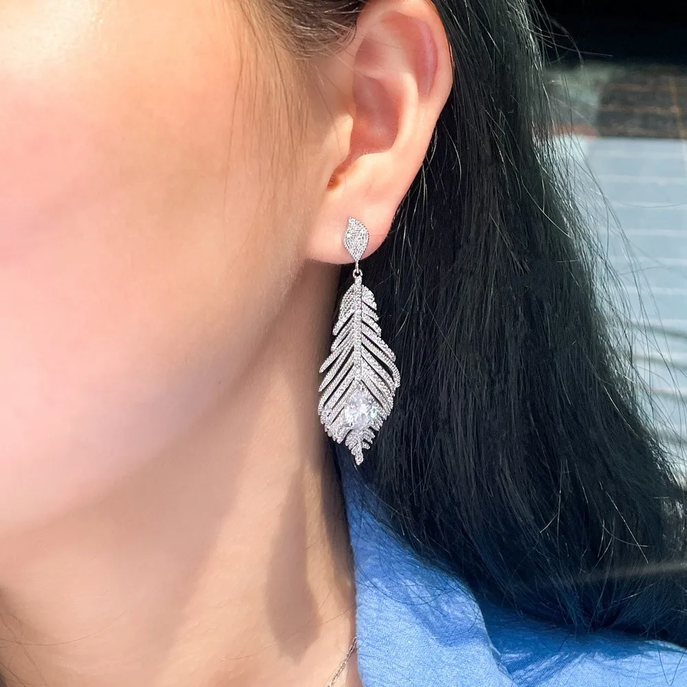 

Women's Feather-Embellished Zircon Pendant Earrings, luxurious and Fashionable, Made With Hypoallergenic Materials.