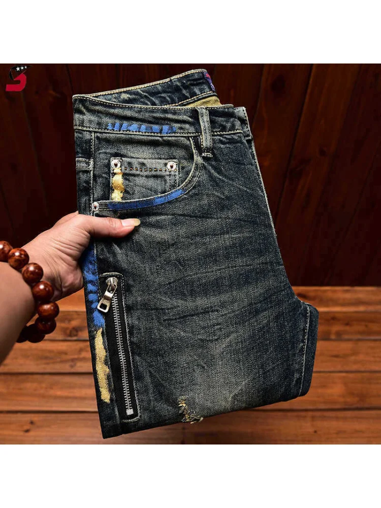 2026 high-end retro jeans men's ripped patch embroidered print small foot elastic slim fit casual American long pants