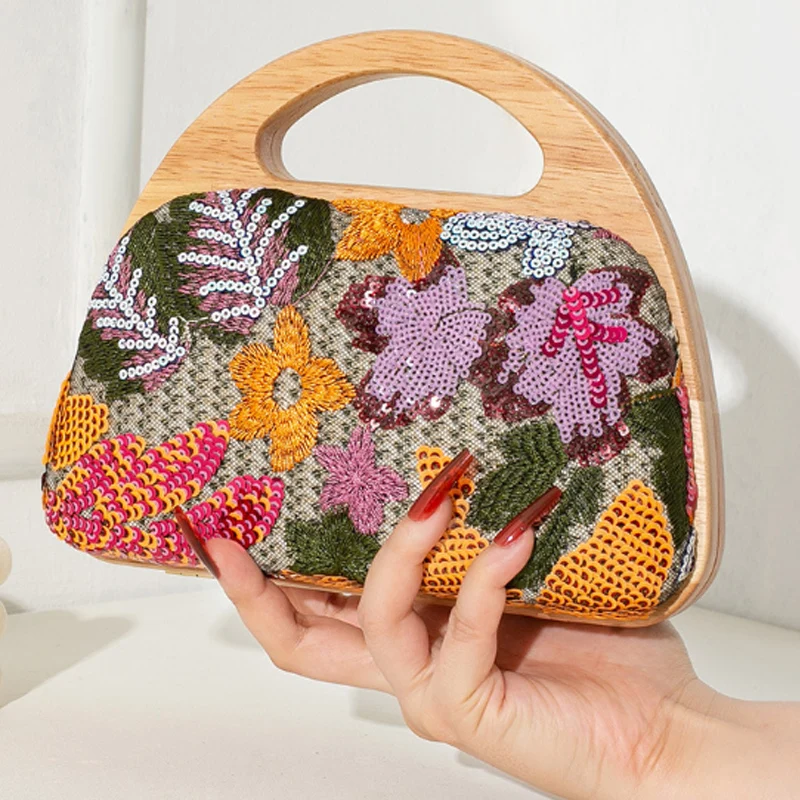 

New Women's Banquet Bag Solid Wood Handheld Straw Weaving Clip Bag Fashion Splicing Embroidered Handmade Chain Crossbody Bag