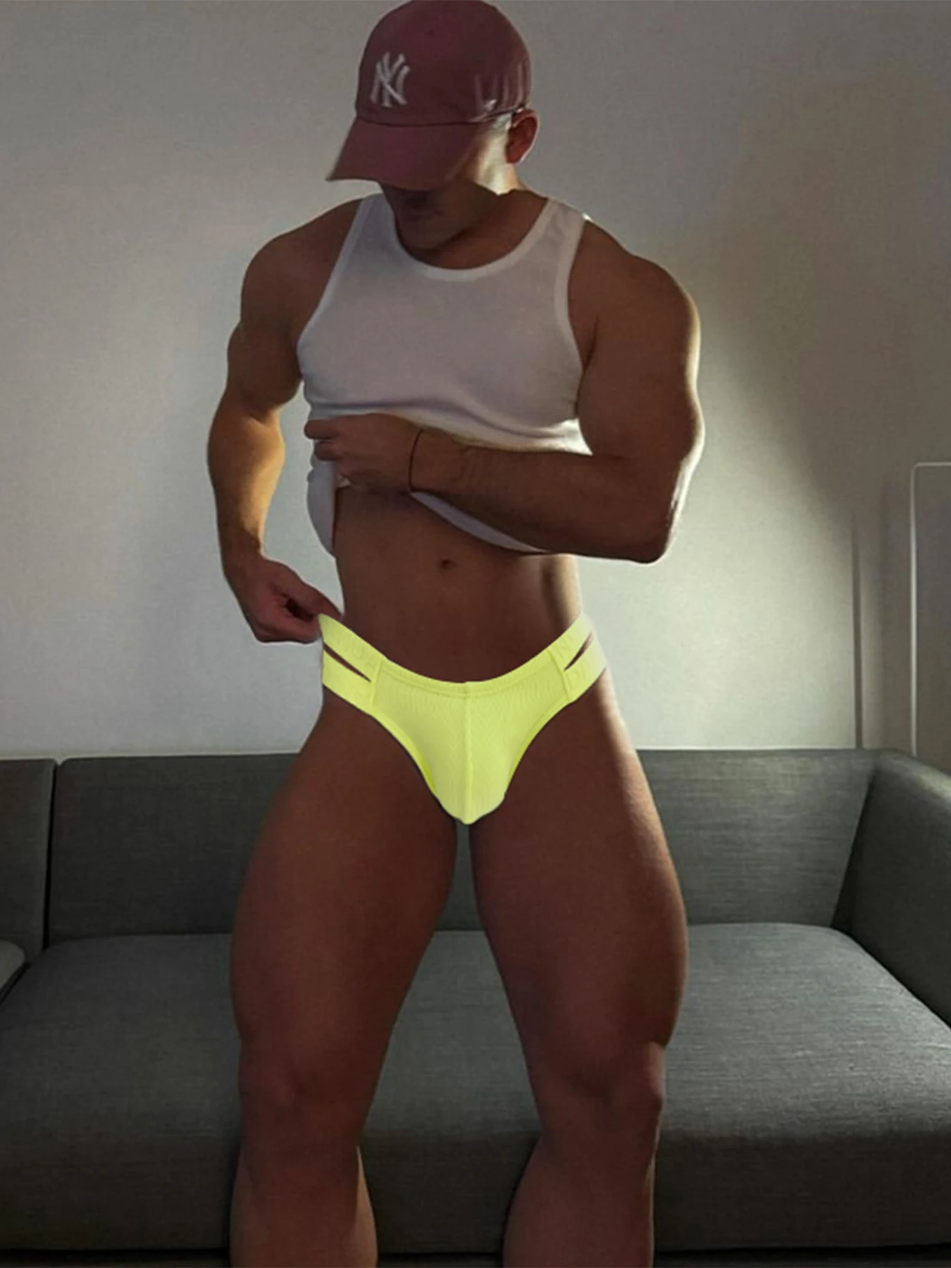 

High cut men's triangle pants with threaded cotton double waistband hollowed out low rise hip lifting underwear for men.