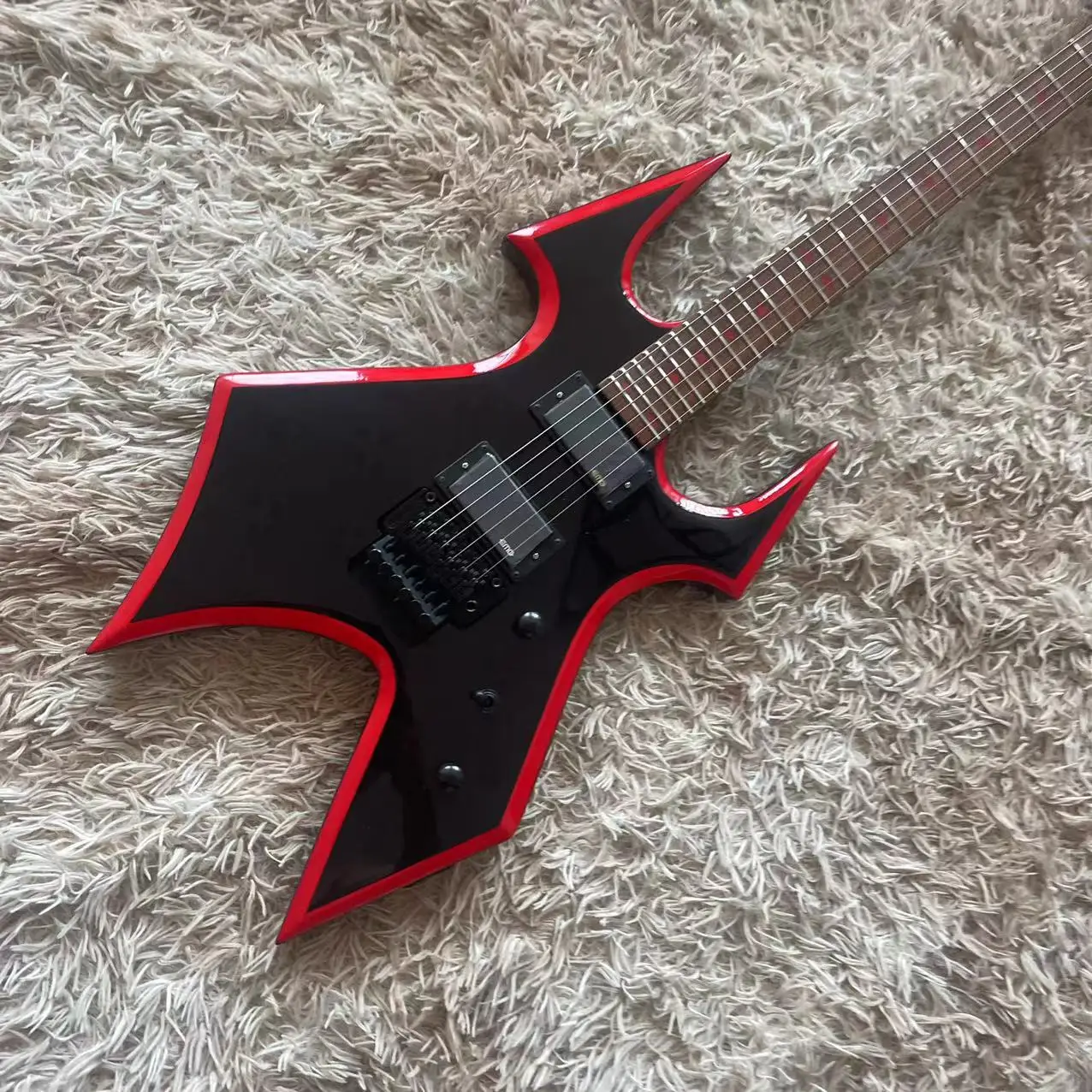 B. C. Rich special-shaped all-in-one Electric guitar, black body, red rim, high gloss, black accessories, LP string bridge, EMG