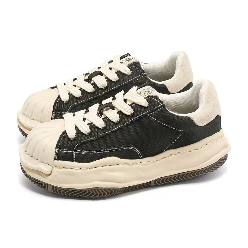 

Черные низкие кеды на массивной подошве, винтажные, из канваса, с носком-ракушкой, с эффектом расплавленной подошвы