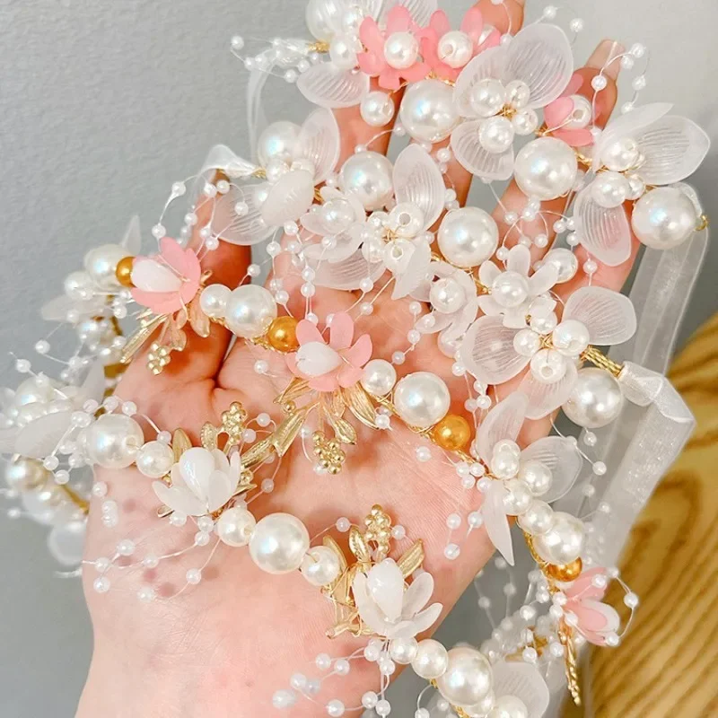 

Ободок для волос детский с искусственным жемчугом и искусственным цветком