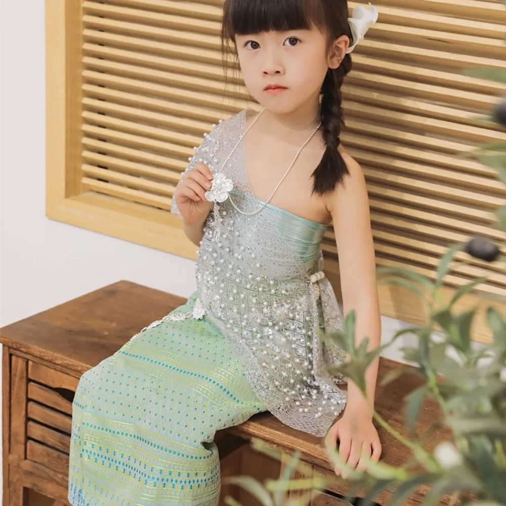 Strój na festiwal Dai w stylu tajskim, etniczny, z pozłacanym splotem, tradycyjny strój tajski, spódnica z łańcuszkiem w talii, zestaw tajski, top i spódnica, podróż