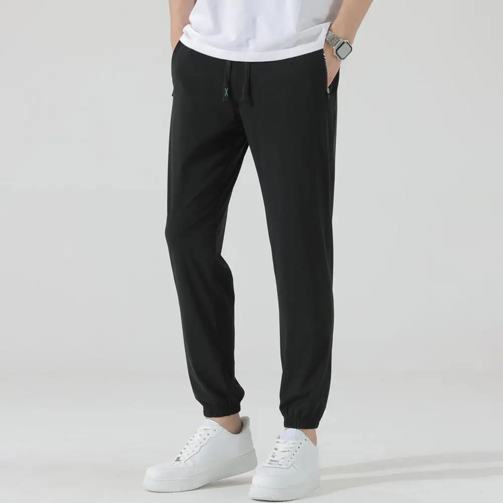 

Men Sports Pants Solid Color Men Pants Quick Dry Unisex Gym Sweatpants with Side Pockets Drawstring Waist Ice Silk for Jogging