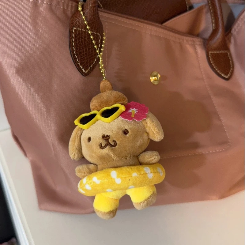 Zwart lederen zwemringen Pudding Hond Poppen Leuke cartoonanimatie Perifere knuffels Rugzakken Pluche hangers Meisjescadeau