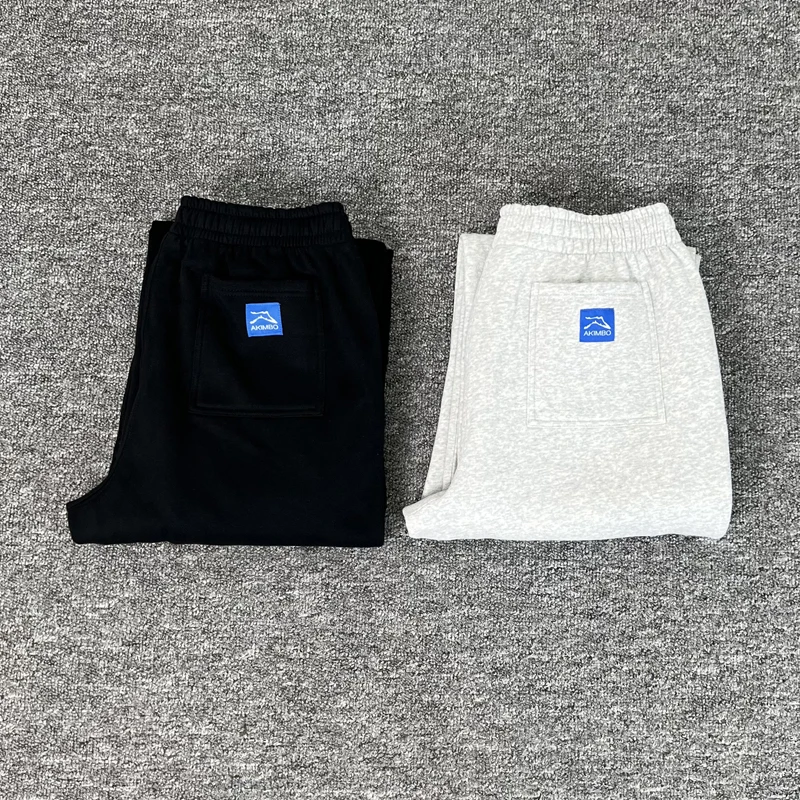 

American High Street AKIMBO Sweatpants Retro Pocket Logo Trousers Hip Hop Style Loose Drawstring Casual Pants Men Women