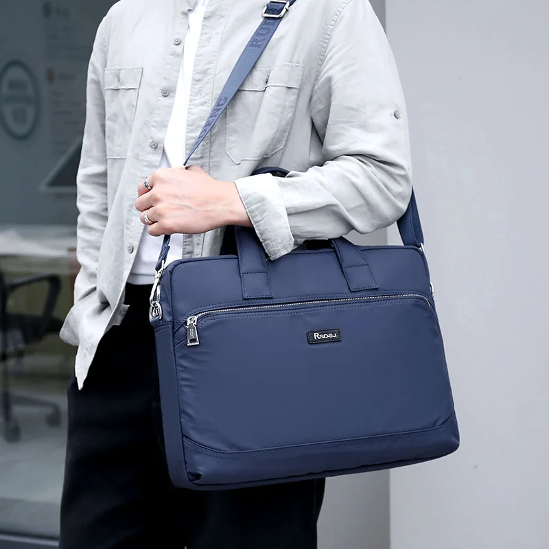 กระเป๋าเอกสารผู้ชายสุดหรูอเนกประสงค์ ทำจากไนลอน กระเป๋าทำงานเรียบง่าย ความจุขนาดใหญ่ สะพายไหล่เดียว ใช้เป็นกระเป๋าถือสำหรับนักธุรกิจหรือกระเป๋าสะพายข้าง