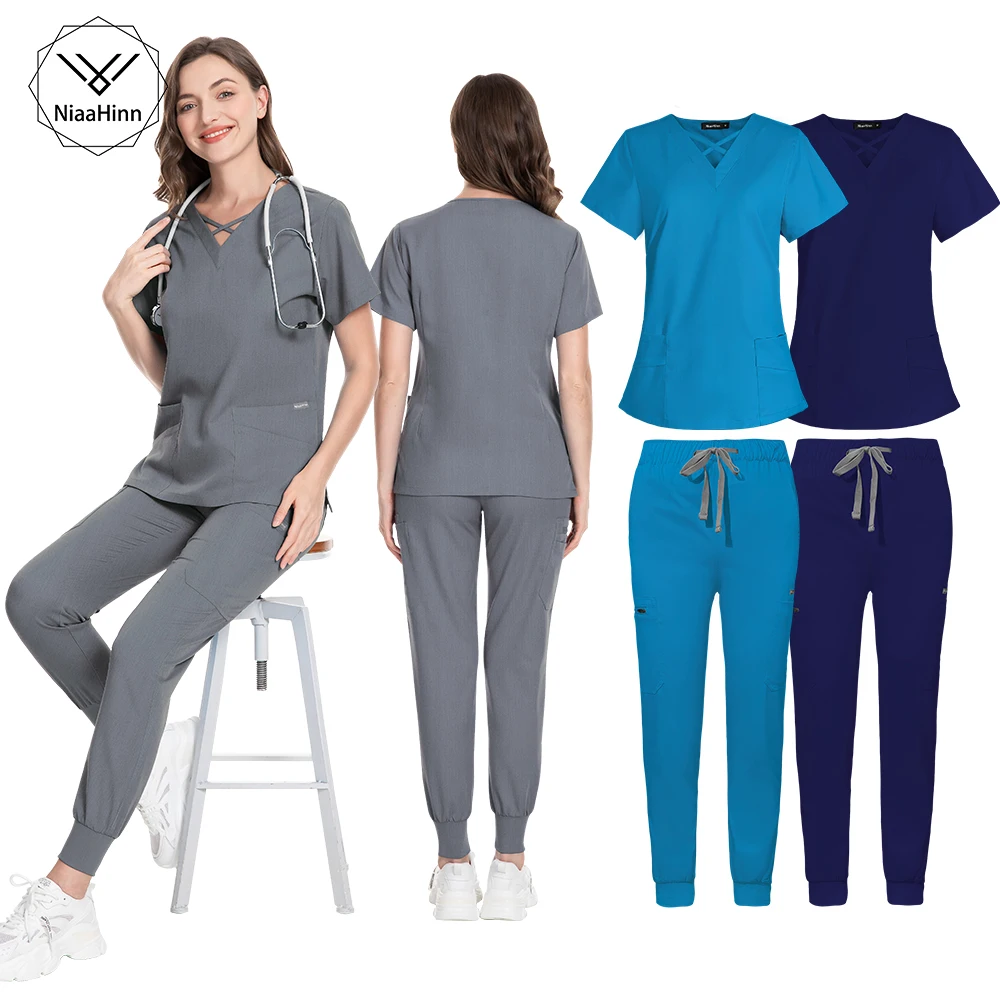 Uniformes de enfermera de alta calidad a la moda, Tops de manga corta, conjuntos de pantalones, artículos de enfermería al por mayor, uniforme clínico para mujer