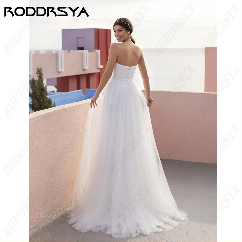 RODDRSYA Simples Strapless Vestido De Noiva Para As Mulheres Sem Mangas Pérolas Backless Lace Vestidos De Novia Tulle A Linha Noiva FestaSimples Strapless Vestido De Noiva Para As Mulheres Sem Mangas Pérolas Backless L