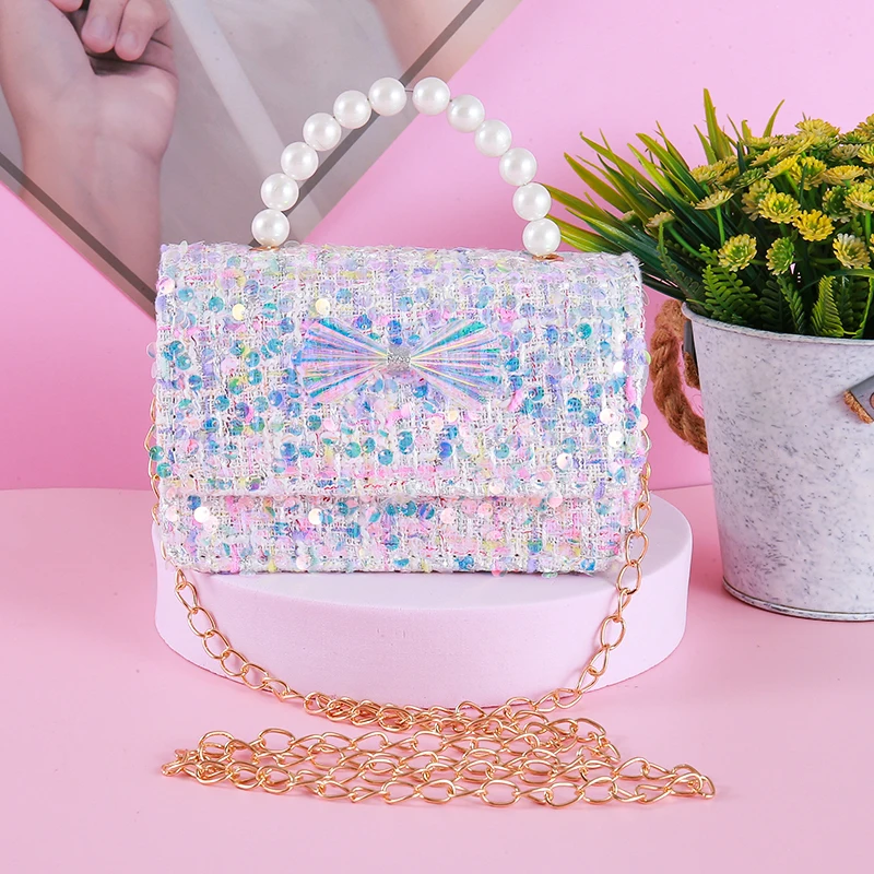 Mini sac à main à nœud laser mignon pour filles, sac à bandoulière princesse pour enfants, sacs à main pour la journée des enfants, poignée de perles pour bébé, nouveau, 2024