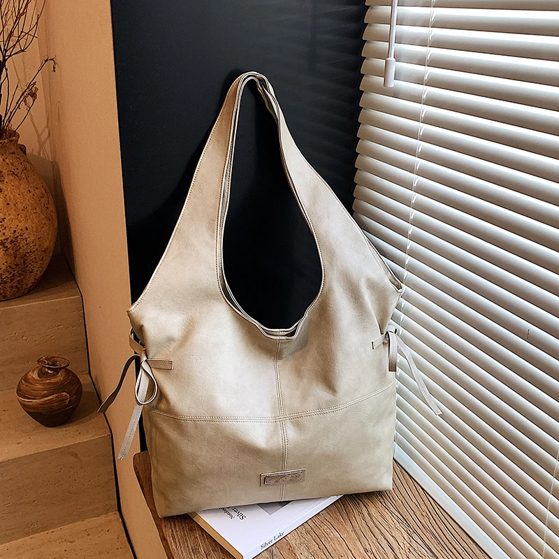 2025 Autunno/Inverno Tote casual di grande capacità Borse a tracolla in tinta unita con cerniera in PU Borse da viaggio quotidiane durevoli impermeabili