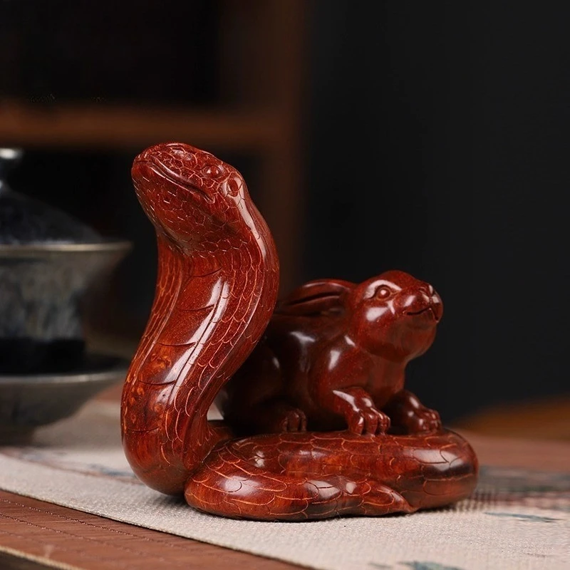 

Small leaf red sandalwood hand-carved zodiac snake rabbit tabletop ornament