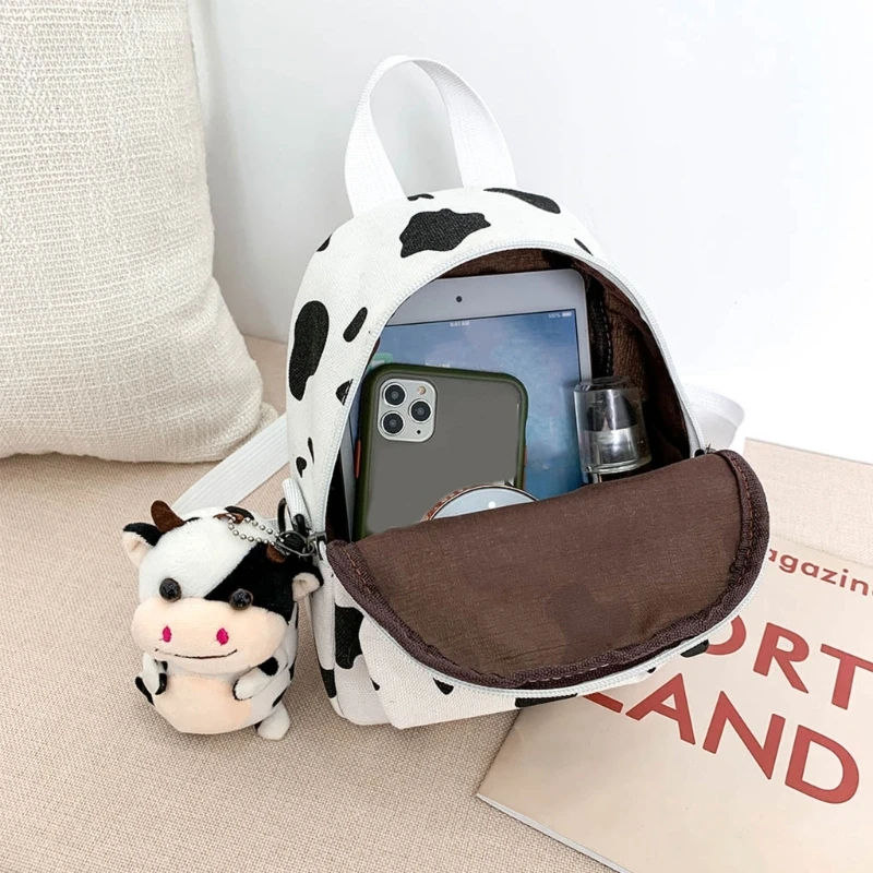 E74B Mini Canvas Daypack with Plush Pendant Cow Print Backpack for Women Lady Girls Outdoor Travel Shopping Shoulder Bag Bookbag