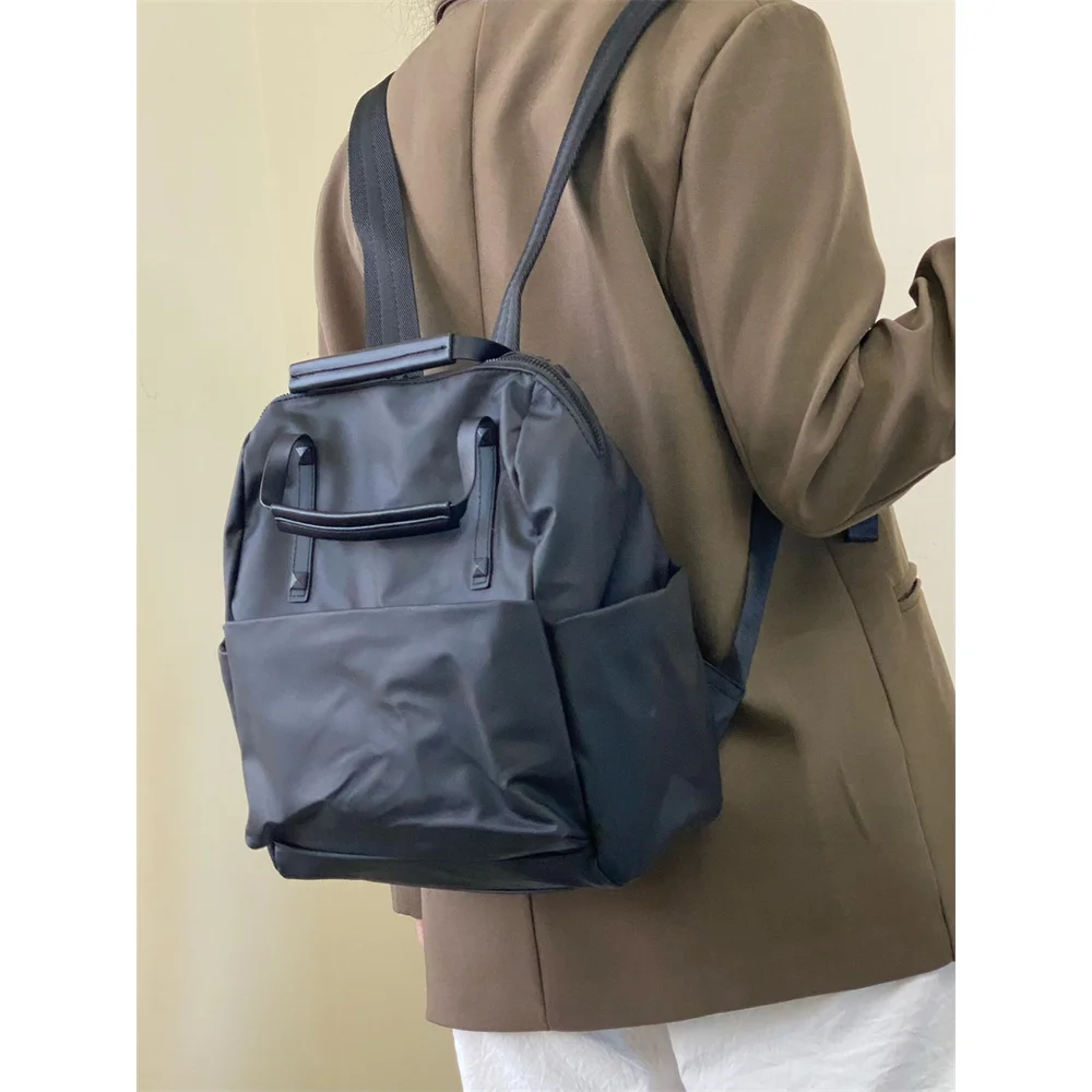 Waterproof Nylon Backpack 2025 New Trendy Travel Backpack Fashionable and Versatile Handheld Lightweight Commuter Backpack