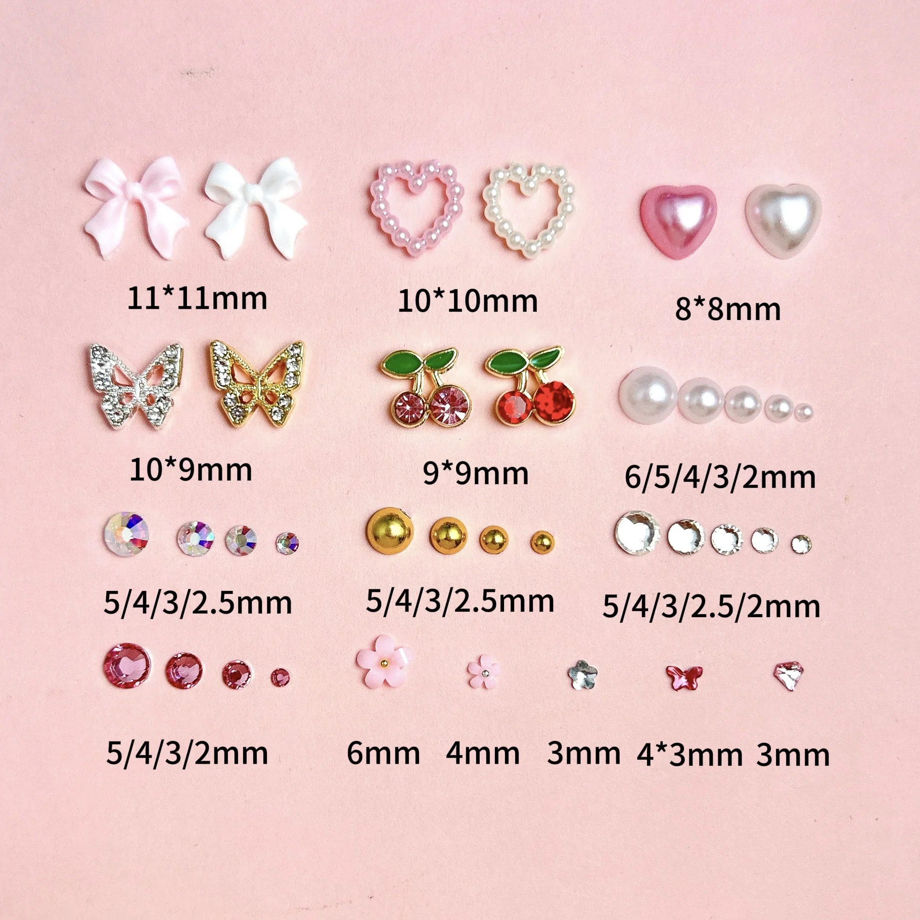 1 صندوق عشوائي مختلط سبيكة فراشة الكرز مسمار السحر شفافة القوس زهرة مقلد اللؤلؤ مختلط مسمار الفن زينة DIY الأظافر