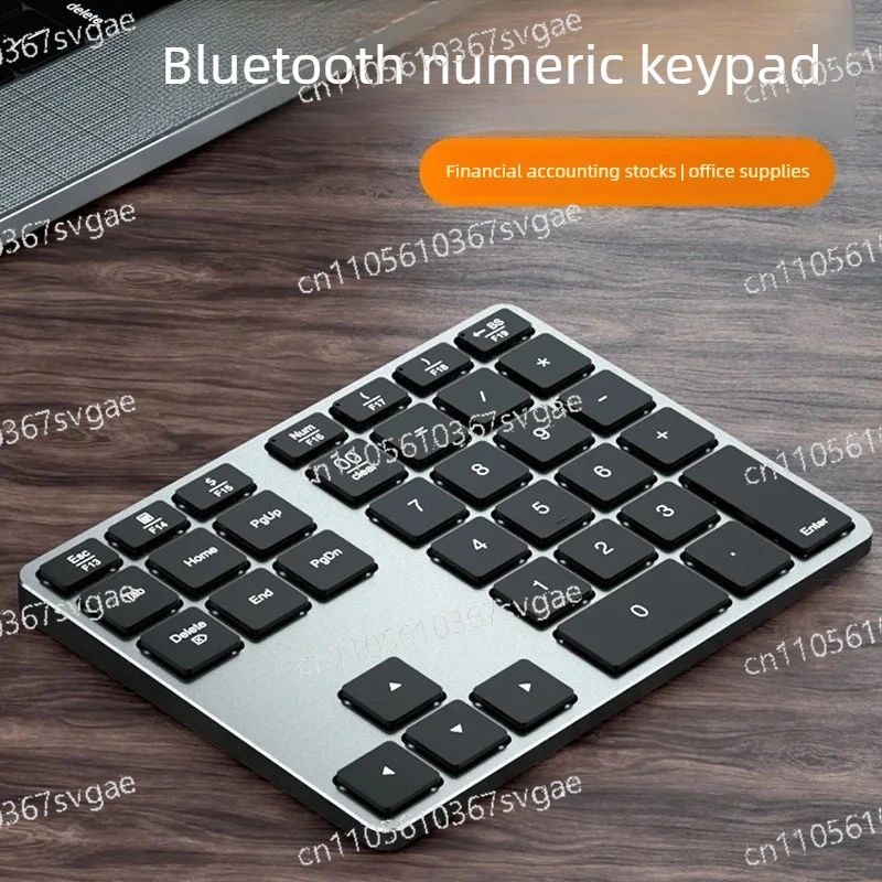 

Беспроводная Bluetooth-клавиатура из алюминиевого сплава с 35 клавишами, подходит для мобильных телефонов, планшетов, iPad, ноутбуков, настольных компьютеров.