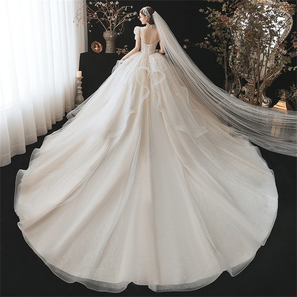 Maßgeschneiderte Luxus High Neck Kristall Tüll Puff Ärmeln Ballkleid Brautkleider 2024 Kapelle Zug Brautkleid Vestidos De Novia