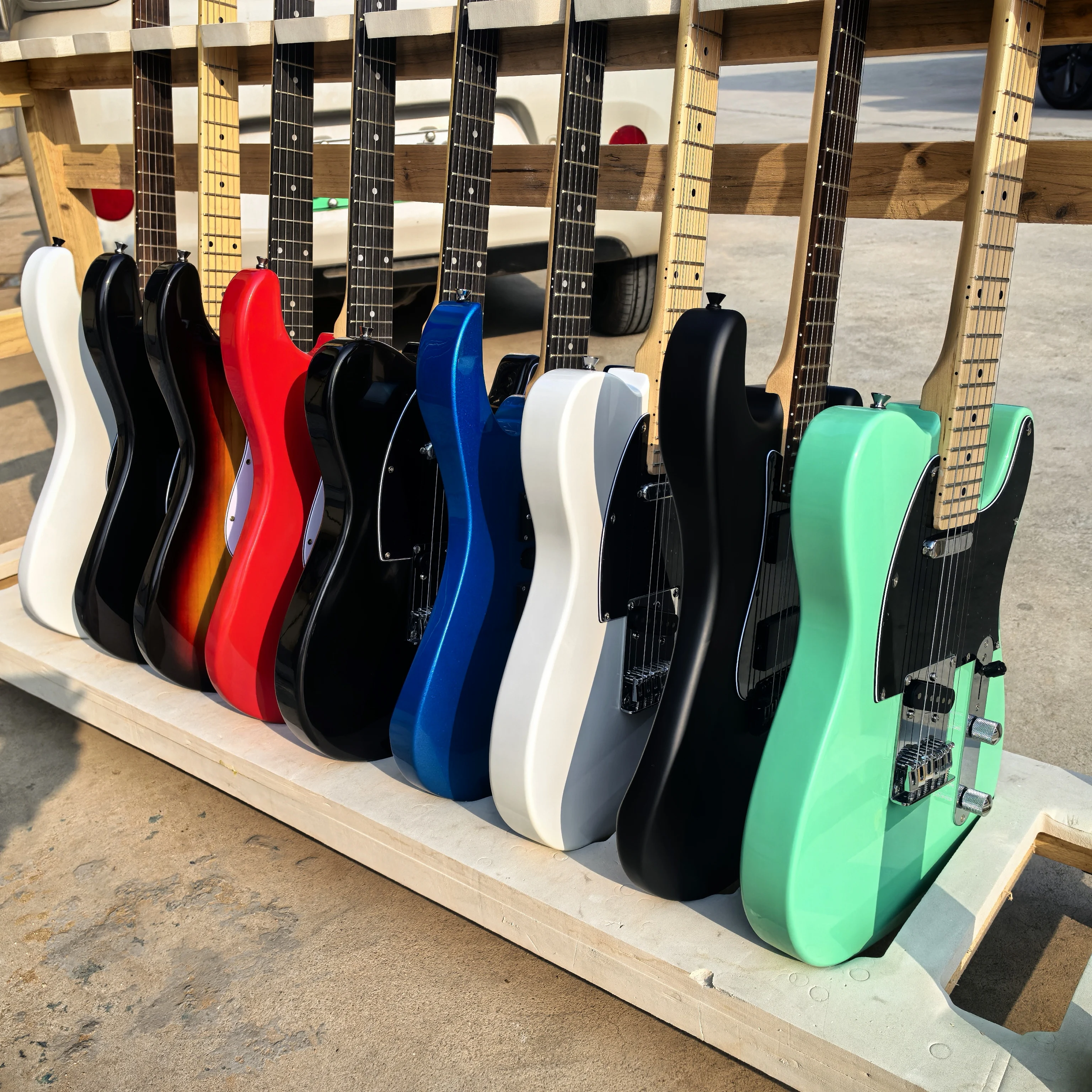 Custom colors available, end-of-line clearance: green 6-string electric guitar, with green, black, white, and sunset color