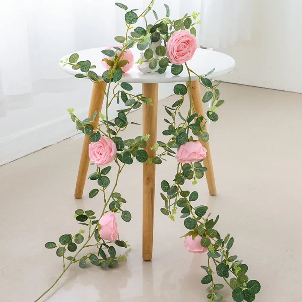 1 قطعة نبات اصطناعي من الحرير الوردي والأوراق الخضراء المعلقة على الحائط لتزيين المنزل ومستلزمات حفلات أعياد الميلاد