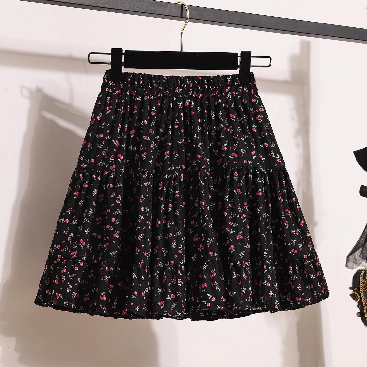 伸縮性のある韓国風レディーススカート、夏のプリントチュチュフック、花柄ルーズミディスカート、エレガントな女性用カジュアルオールマッチスカート、新作