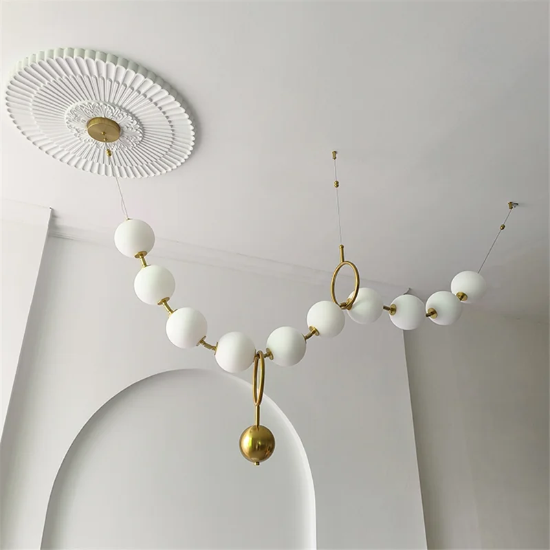 

Modern minimalist design bar counter light strip background wall acrylic pearl living room pendant light