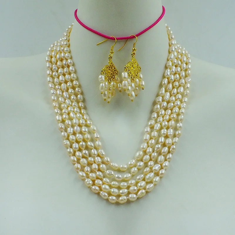 

5 rows of 6mm 100% natural pink cultured freshwater pearl necklace earrings. The last set