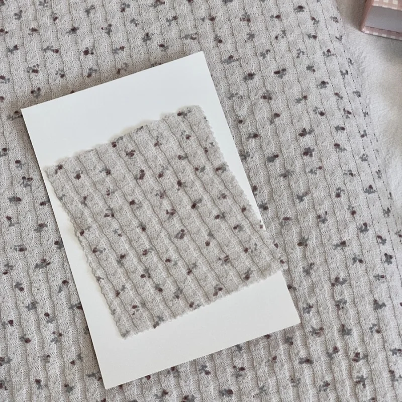 

New cream-colored stretch knitted fabric for DIY hair clips, children's clothing, and floral-patterned fabric.