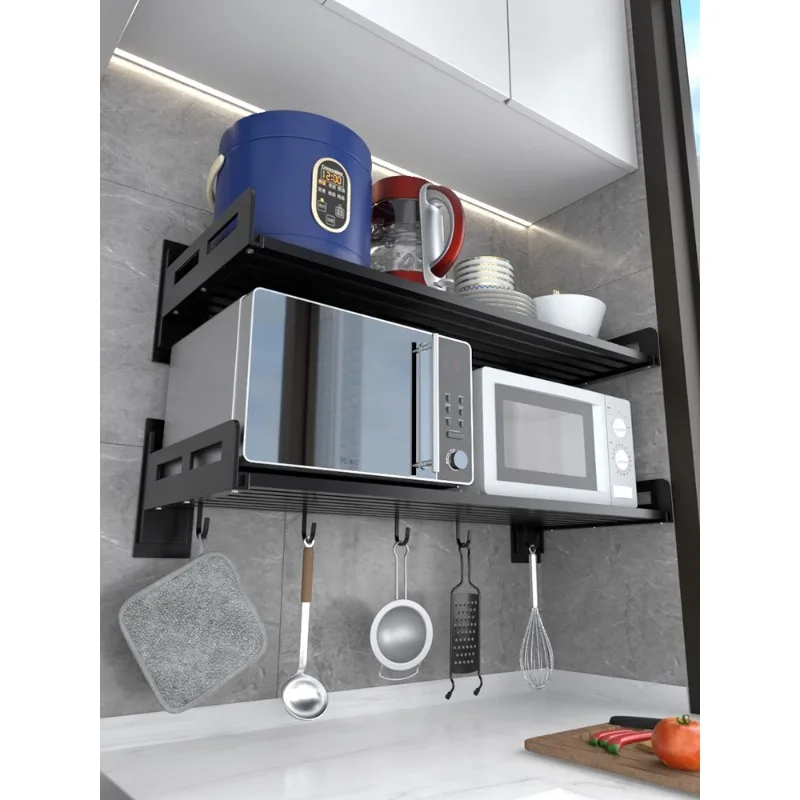 Stainless steel perforated kitchen storage rack, black wall mounted microwave oven, wall mounted bracket, storage rack