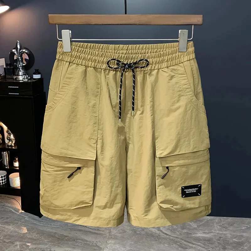 

Casual multi pocket work pants for men in the summer of 2026, thin, trendy, quick drying, loose fit, sporty cropped