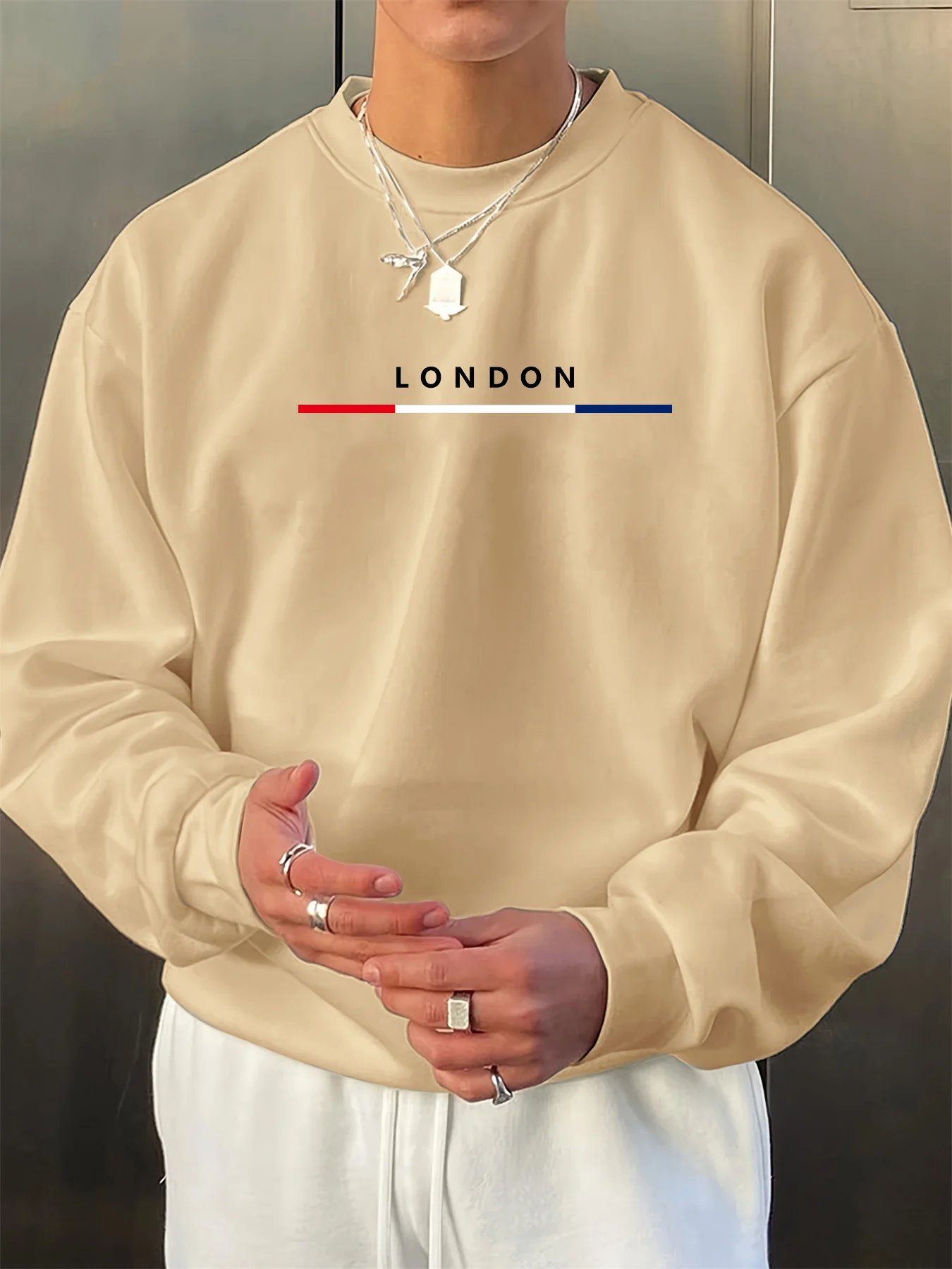 سترة رجالية عصرية للخريف والشتاء فضفاضة بنمط حروف لندن مطبوعة بأكمام طويلة ورقبة دائرية