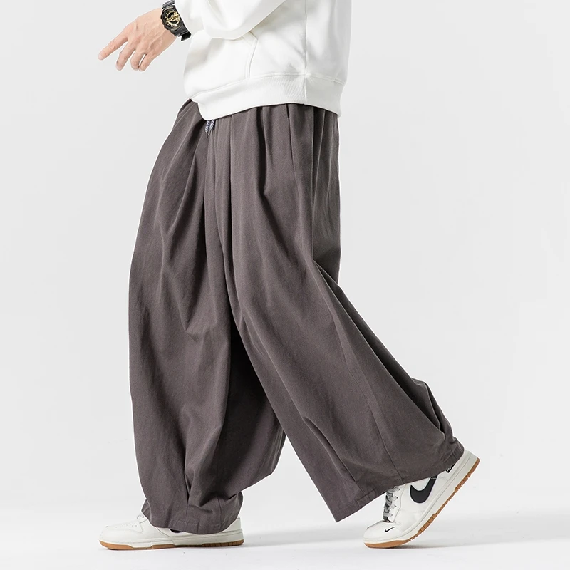 Pantaloni a gamba larga da uomo oversize pantaloni da jogging elastici in vita pantaloni da uomo Casual Harem pantaloni larghi da uomo di moda di grandi dimensioni 5XL