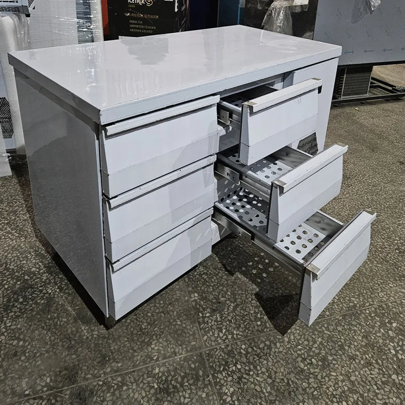 

Stainless steel kitchen prep countertop with 6 refrigerated drawers at the bottom
