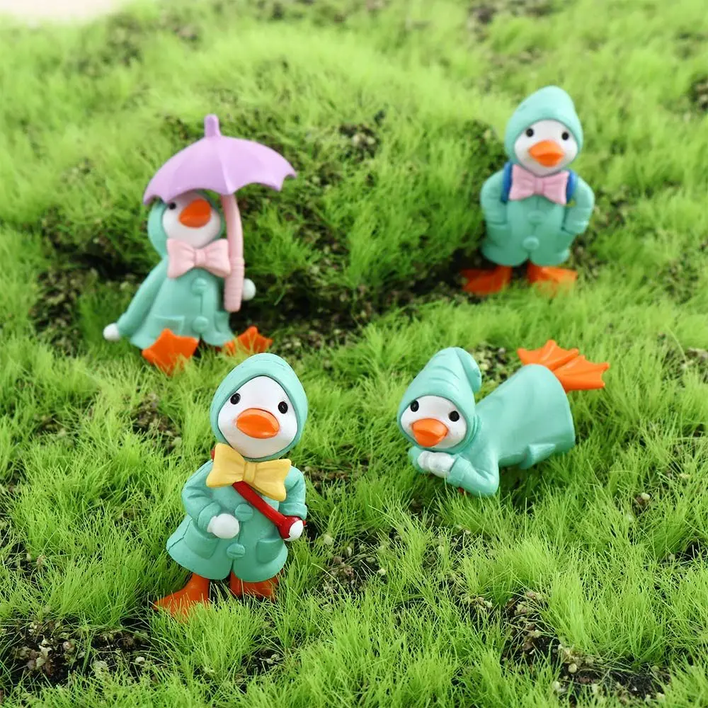 

4Pcs/Set Kawaii Animal Decor Fairy Garden Raincoat Duck Resin Cartoon Cake Decoration Miniature Micro Landscape Figurine