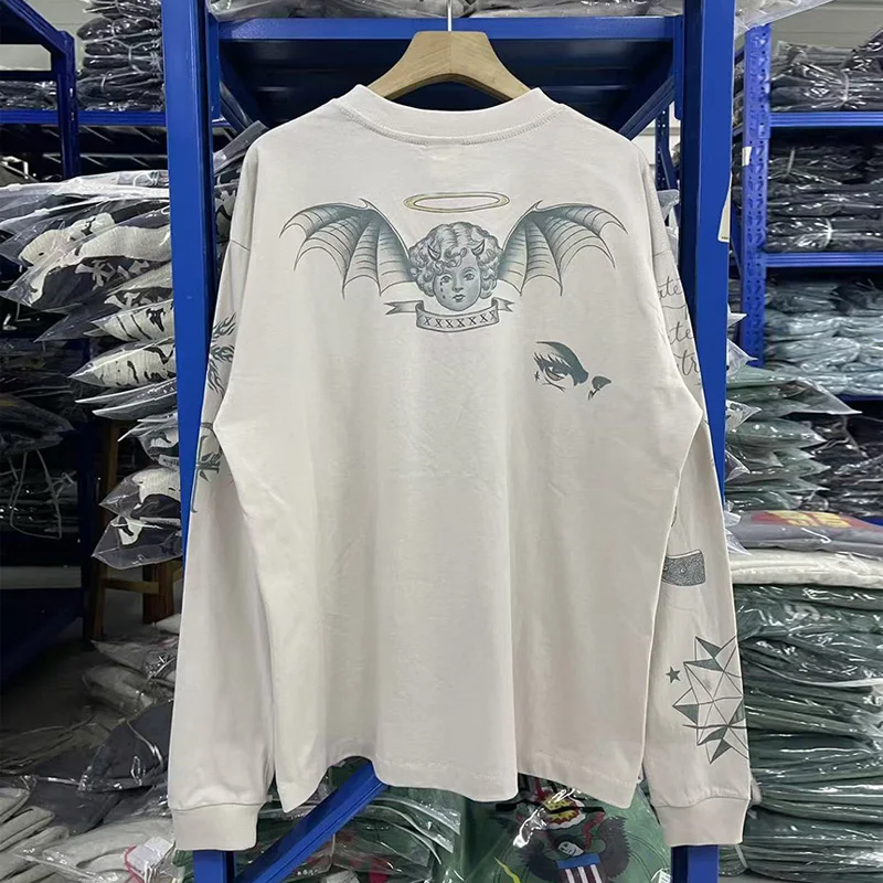 الكرتون الرسومات الكتابة على الجدران طباعة الاسمنت الأبيض قاعدة تي شيرت المحملة الرجال النساء أعلى جودة القطن المتضخم سانت بأكمام طويلة تي شيرت