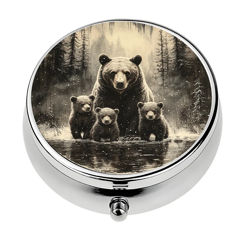 A mini pill box, single compartment, divided into three sections, designed to resemble a bear family in a winter forest. This metal pill box is a unique travel gift, perfect for keeping vitamins and medication neat and organized while on the go.