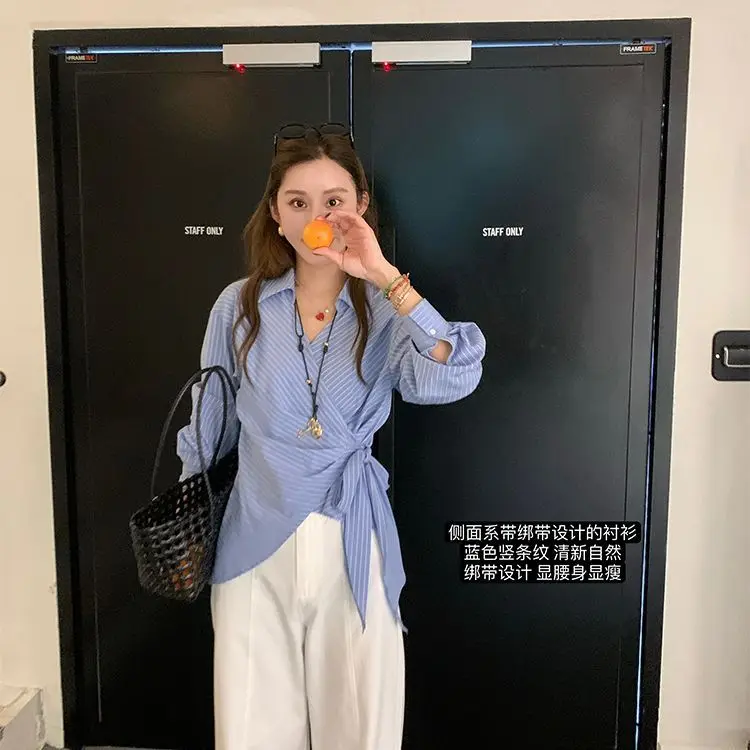 

Gagarich 2025 New Appearing Slim Waist Blue Vertical Stripe Tied Shirt Early Spring New Ins Crossed Small Collar Top Women