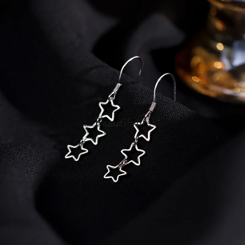 

Hollow star earrings women's niche design fashion meteor ear hook long