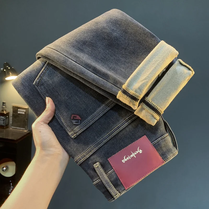 

Velvet jeans men's winter new tapered slim fit, cold resistant, thick and warm, small feet high-end men's pants