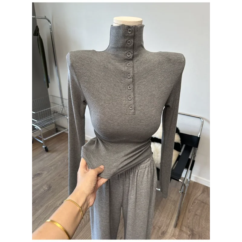 

Women's New Spliced commuting Sweet Button High-neck Long-sleeved T-shirt Shoulder Pads Advanced Bottoming Top