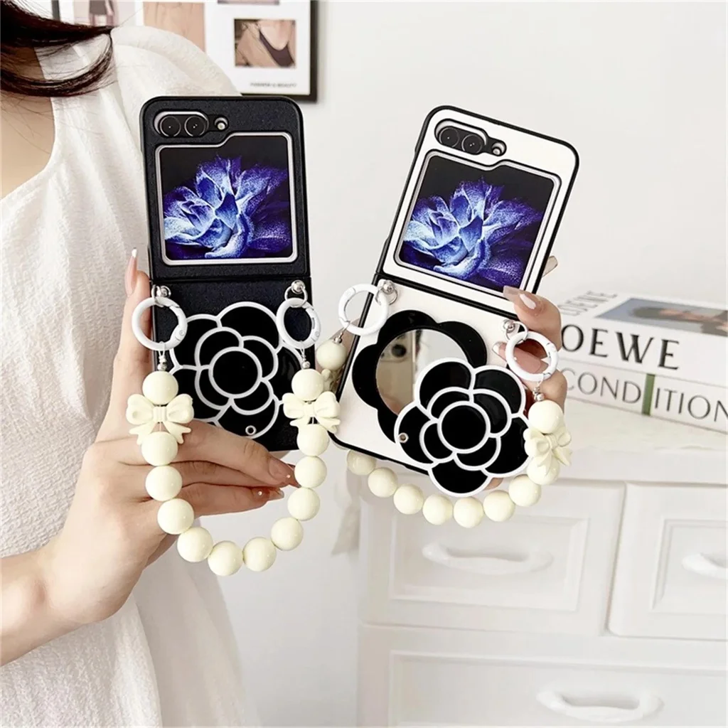 

Korean Luxury Camellia Flower Mirror Bow Bracelet Hand Chain Phone Case For Samsung Z Flip 4G 6 5 4 3 Shockproof Leather Cover