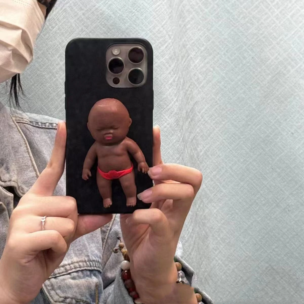 Interesting funny phone case black doll red shorts suitable for iPhone 1514 phone case all inclusive transparent 16 12 13promax