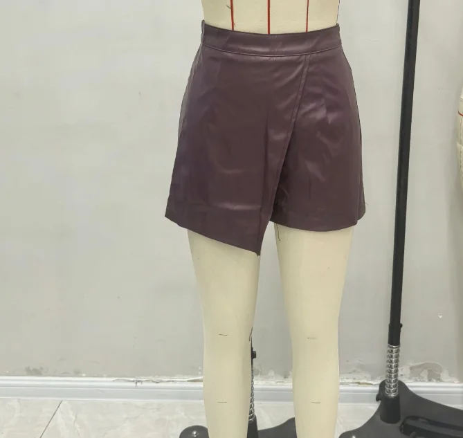 Pantalones cortos de moda de cintura alta para mujer, estilo callejero personalizado, asimétrico, de cuero PU, elásticos, ajustados y sexis, falda de otoño