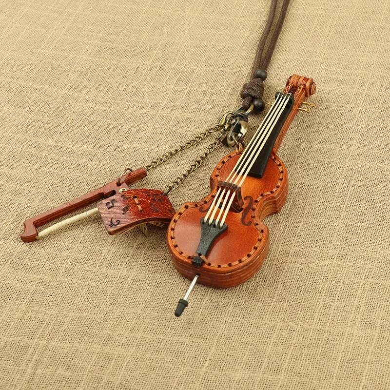 

Music enthusiast exquisite violin bass bag pendant cowhide handmade leather mini leather instrument bag pendant decoration