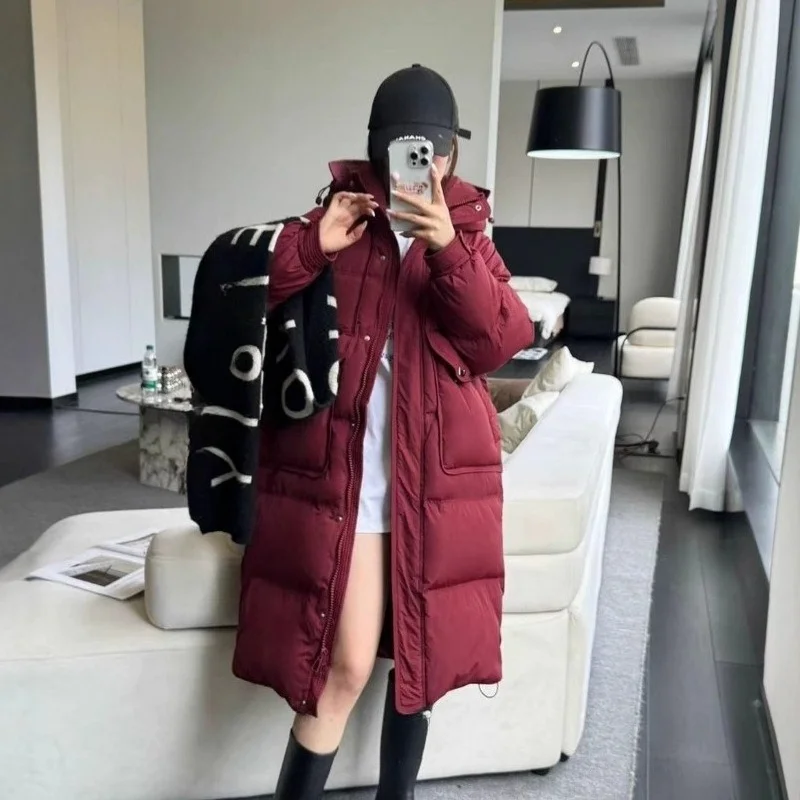 Chaqueta larga de plumón para mujer, moda de invierno 2025, estilo viajero, abrigo cálido adelgazante versátil y grueso elegante a la moda