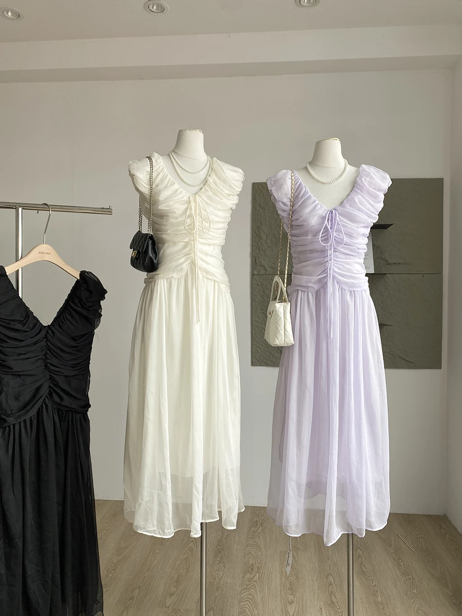 فستان نسائي صيفي أنيق بياقة على شكل V بدون أكمام مكشكش فستان طويل للسيدات بلون سادة وأربطة على شكل حرف A