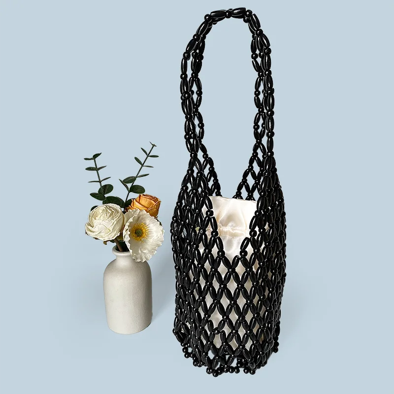 New wooden bead hollowed out handmade bag with female niche design, water bucket bag, versatile commuting shoulder bag for women